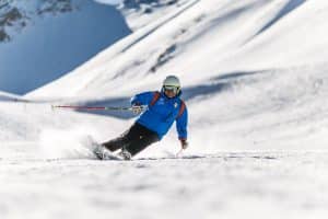 Man Skiing, 5 Tips to a Budget Friendly Ski Vacation